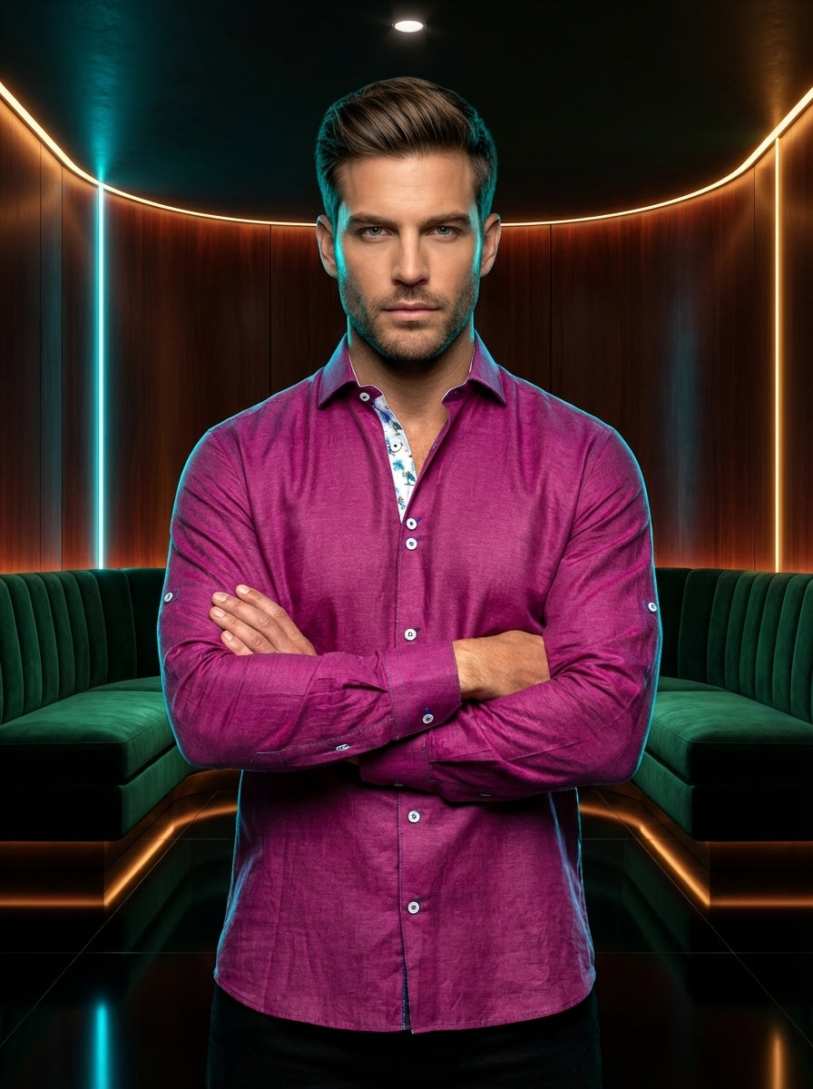 This vibrant magenta long-sleeve shirt features a rich slub texture and a tailored fit. The interior collar is accented with a playful palm tree print, while unique double-button details and contrasting stitching on the buttons add a modern, sophisticated