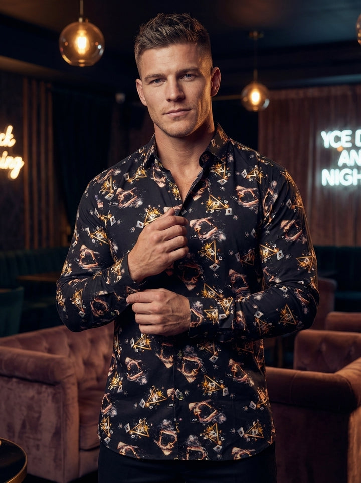This bold, long-sleeved black button-down shirt features a dynamic graphic print of flaming hearts, playing cards, and geometric gold accents. Crafted with a tailored fit, the shirt offers a sophisticated yet edgy look, perfect for making a stylish statem