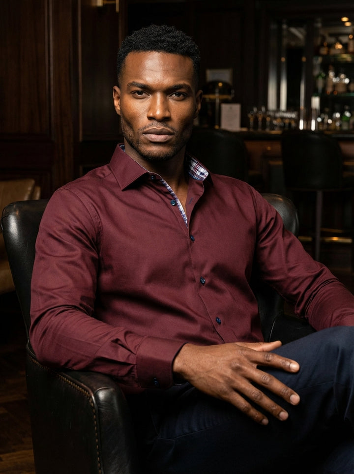 Elevate your wardrobe with this Masutto long-sleeve dress shirt in a rich burgundy hue. Crafted from premium fabric, it features a classic spread collar, blue accent buttons, and a vibrant plaid lining inside the collar for a modern, sophisticated touch.