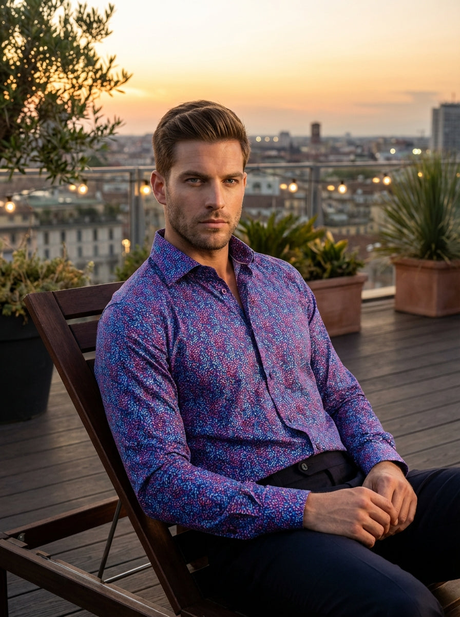 This Masutto long-sleeve button-down features a vibrant all-over micro-floral print in shades of purple, blue, and pink. Crafted with a sophisticated spread collar and tonal buttons, this Italian-designed shirt offers a modern tailored fit perfect for ele