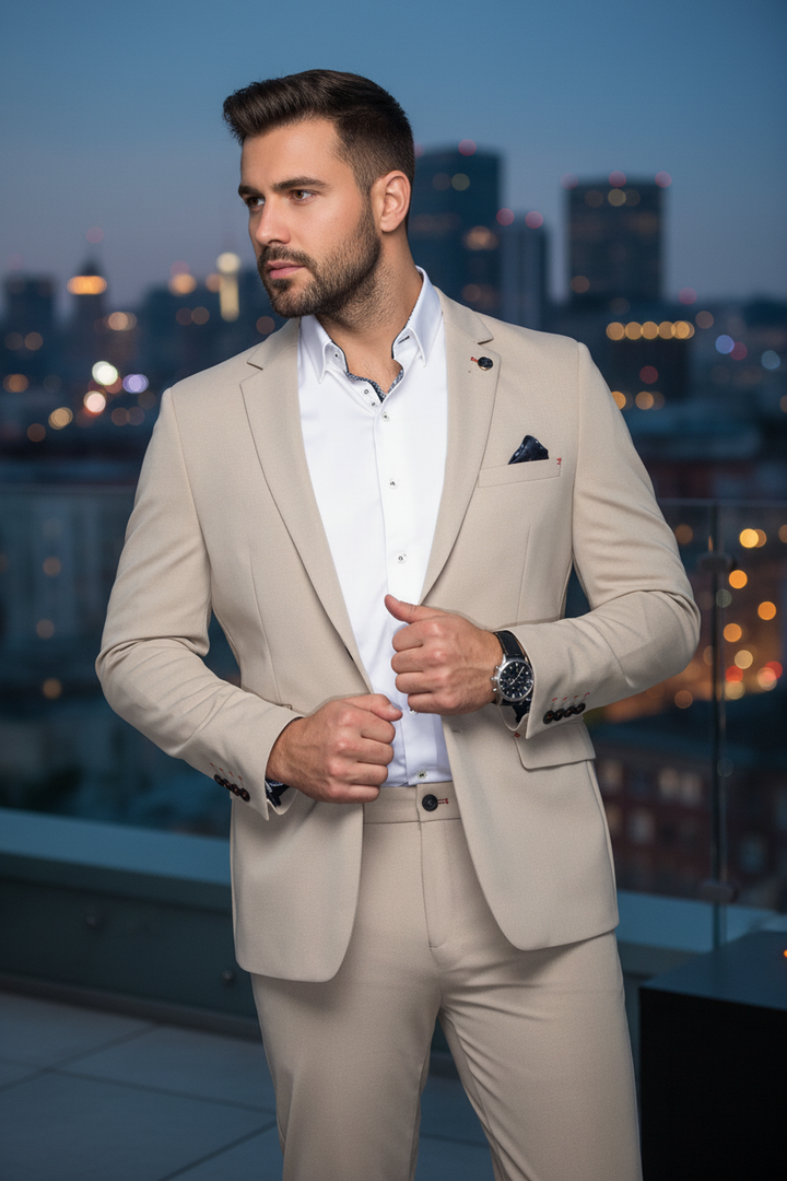 Elevate your wardrobe with this impeccably tailored beige blazer, featuring a refined textured weave and a striking patterned inner collar for a touch of unique sophistication. Perfect for distinguished occasions.