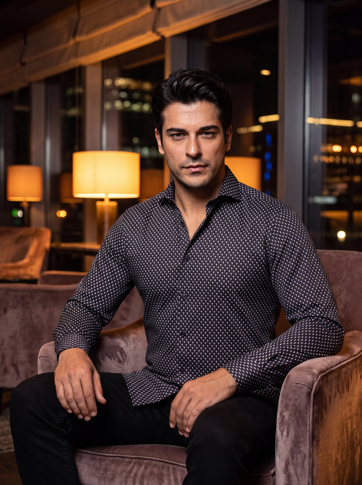 This sophisticated long-sleeve button-down shirt features a classic black base adorned with a meticulous white geometric micro-print. Crafted with a tailored fit, it includes a spread collar and adjustable cuffs, offering a sharp look for modern professio
