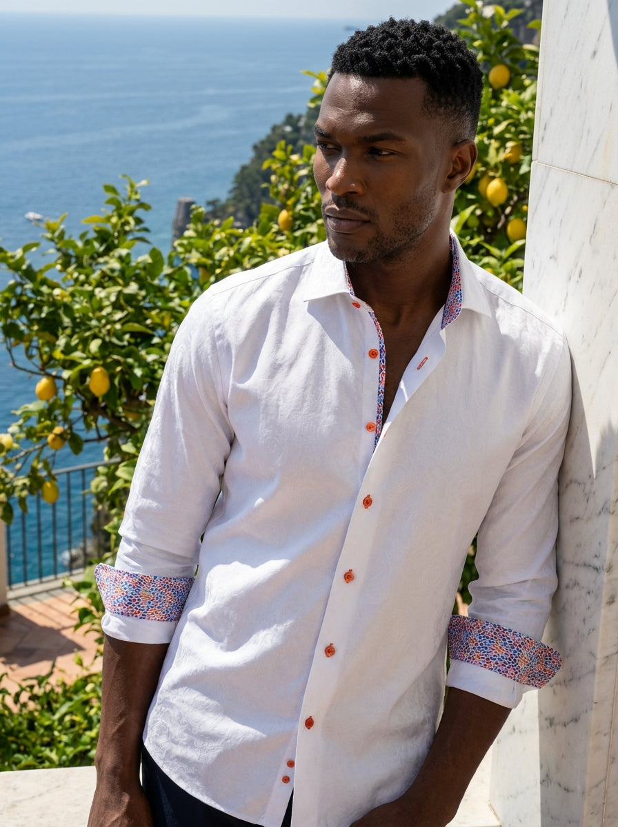 This Masutto white dress shirt features a sophisticated tonal paisley jacquard weave and vibrant orange buttons. The interior collar and cuffs are lined with a colorful mosaic print, adding a modern, playful twist to a classic Italian-designed tailored ga