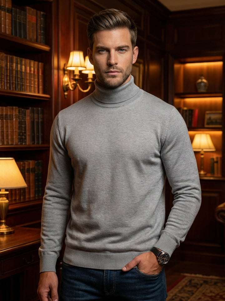 A sophisticated light grey turtleneck sweater crafted from a premium fine-knit blend. This versatile piece features a classic ribbed neck, cuffs, and hem, offering a sleek, tailored silhouette that seamlessly transitions from professional office environme