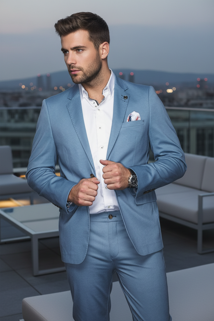 Elevate your wardrobe with this impeccably tailored sky blue suit, featuring a refined textured weave. Paired with a crisp white shirt and subtle pocket square, it offers sophisticated modern elegance for any discerning occasion.
