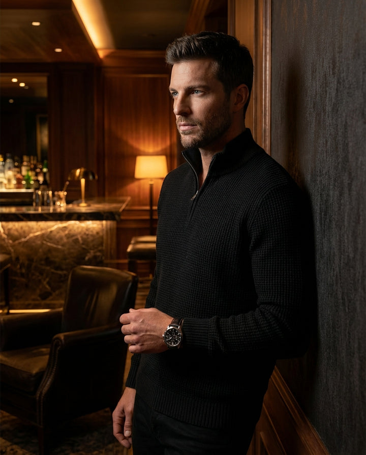 This classic black quarter-zip sweater features a sophisticated waffle knit texture and a high ribbed collar for versatile layering. Crafted with a tailored fit, it provides a sleek silhouette that transitions effortlessly from casual daytime activities t