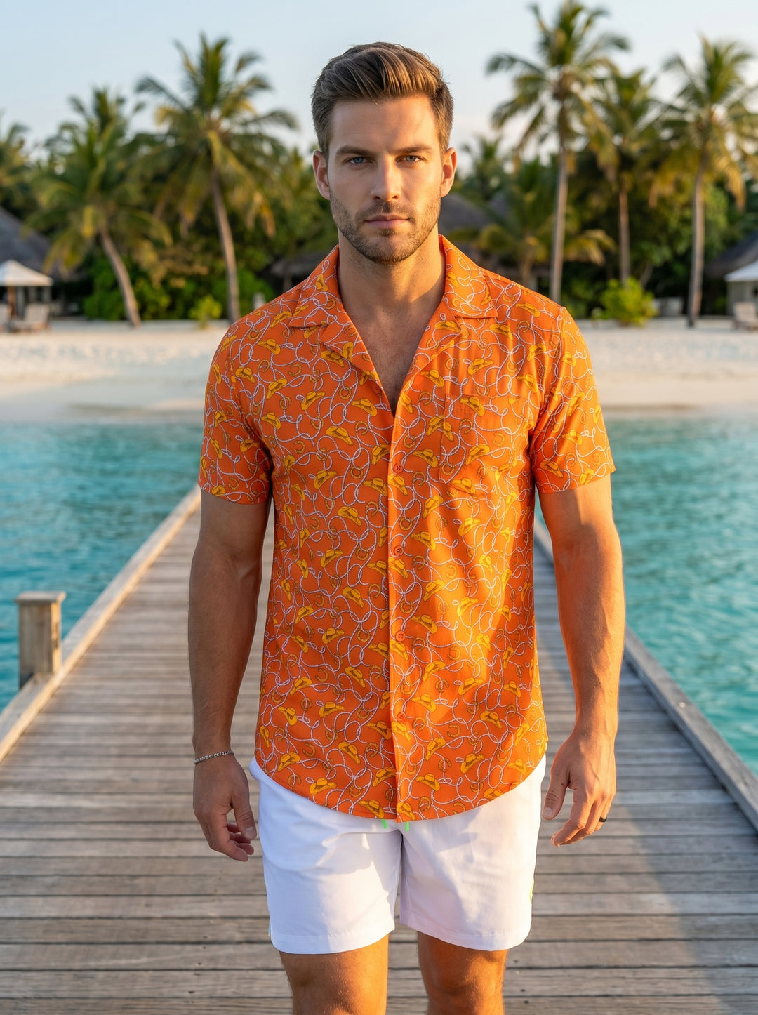This vibrant orange short-sleeved button-down shirt features a playful western-themed print with repeating lasso, cowboy hat, and horseshoe motifs. Crafted for comfort with a relaxed collar and tailored fit, it provides a bold, spirited look perfect for c
