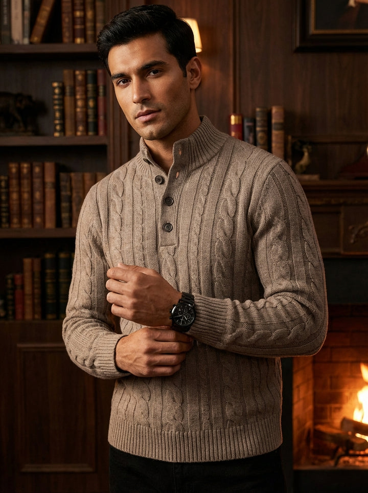 This premium taupe cable-knit sweater features a sophisticated mock neck with a four-button placket. Crafted with intricate textures and ribbed cuffs, it offers a classic slim fit. Perfect for layering, this versatile piece blends traditional craftsmanshi