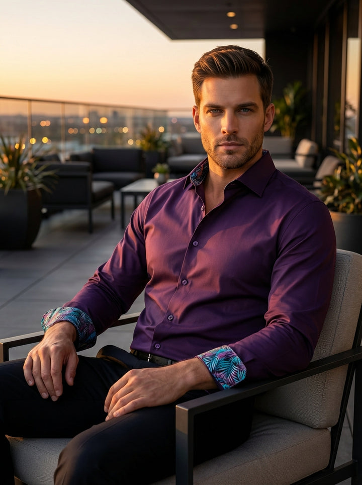This Masutto long-sleeved dress shirt features a deep plum hue with a sophisticated spread collar. Crafted from premium smooth fabric, it includes color-matched buttons and vibrant tropical-patterned trim inside the collar and cuffs, offering a modern twi