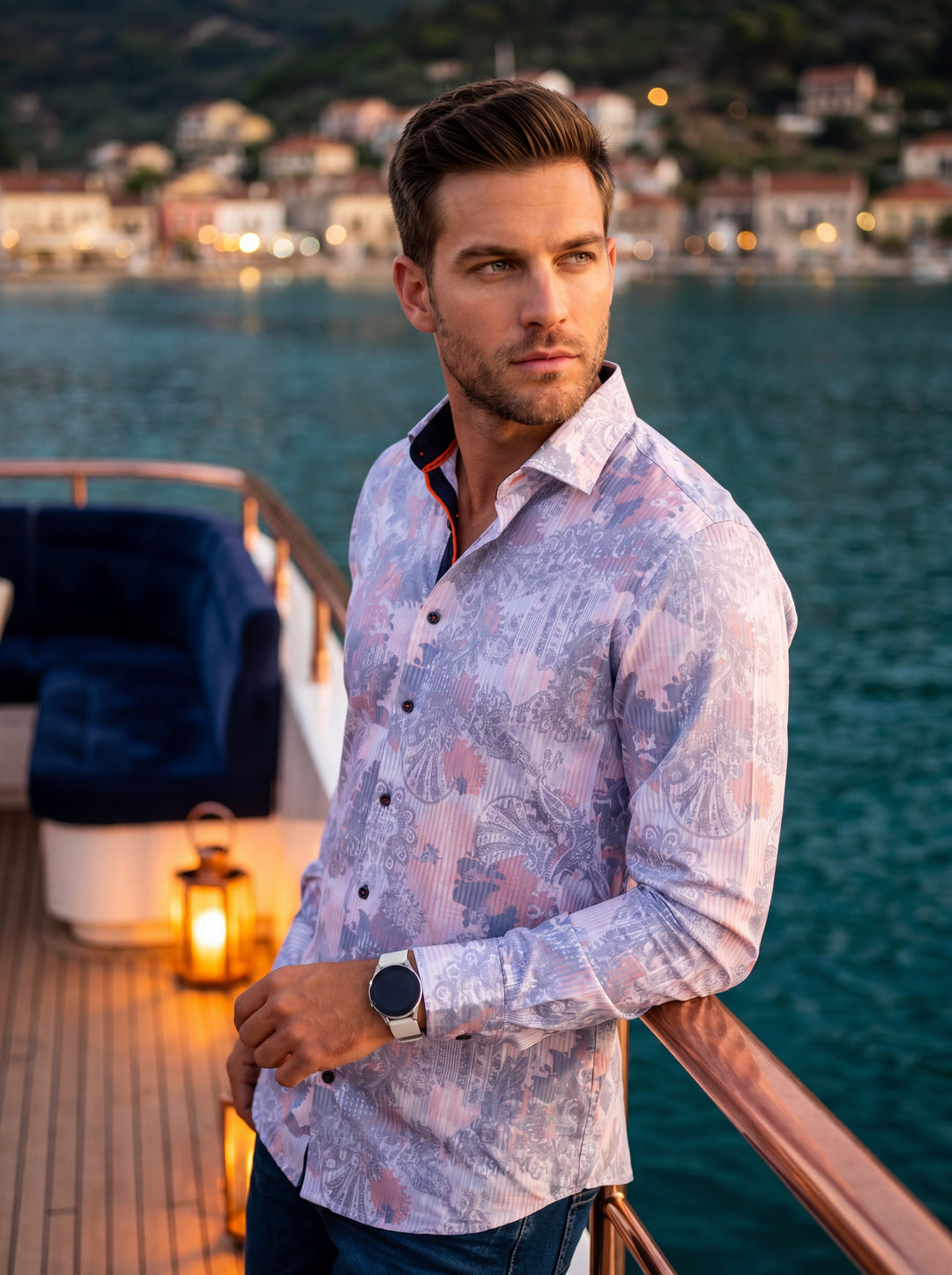 This men's long-sleeve button-down shirt features an intricate, multidimensional print with swirling paisley and floral motifs in soft lavender, blue, and coral hues. The tailored design includes a contrasting dark inner collar with orange accents for a r