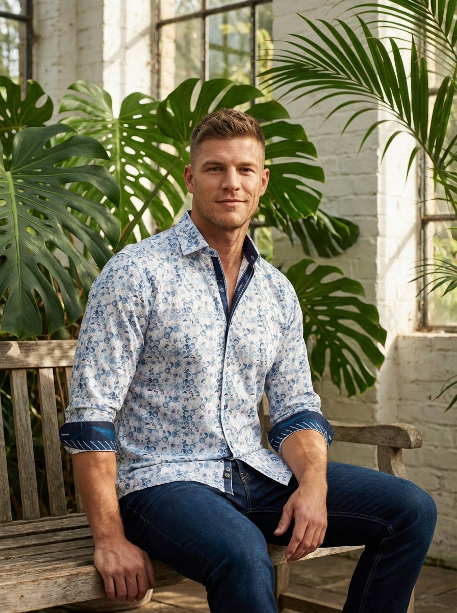 This men's button-down shirt features a sophisticated white and blue hexagonal geometric pattern. The design is accented with high-contrast navy trim on the inner collar, placket, and rolled cuffs, offering a refined, modern look perfect for smart-casual 