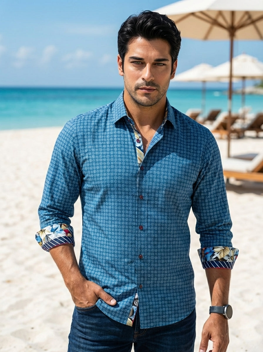 This sophisticated blue button-down shirt features a fine geometric micro-print and striking contrast cuffs with floral and striped motifs. Its tailored fit and unique interior collar detailing make it a versatile piece for the modern man seeking a stylis