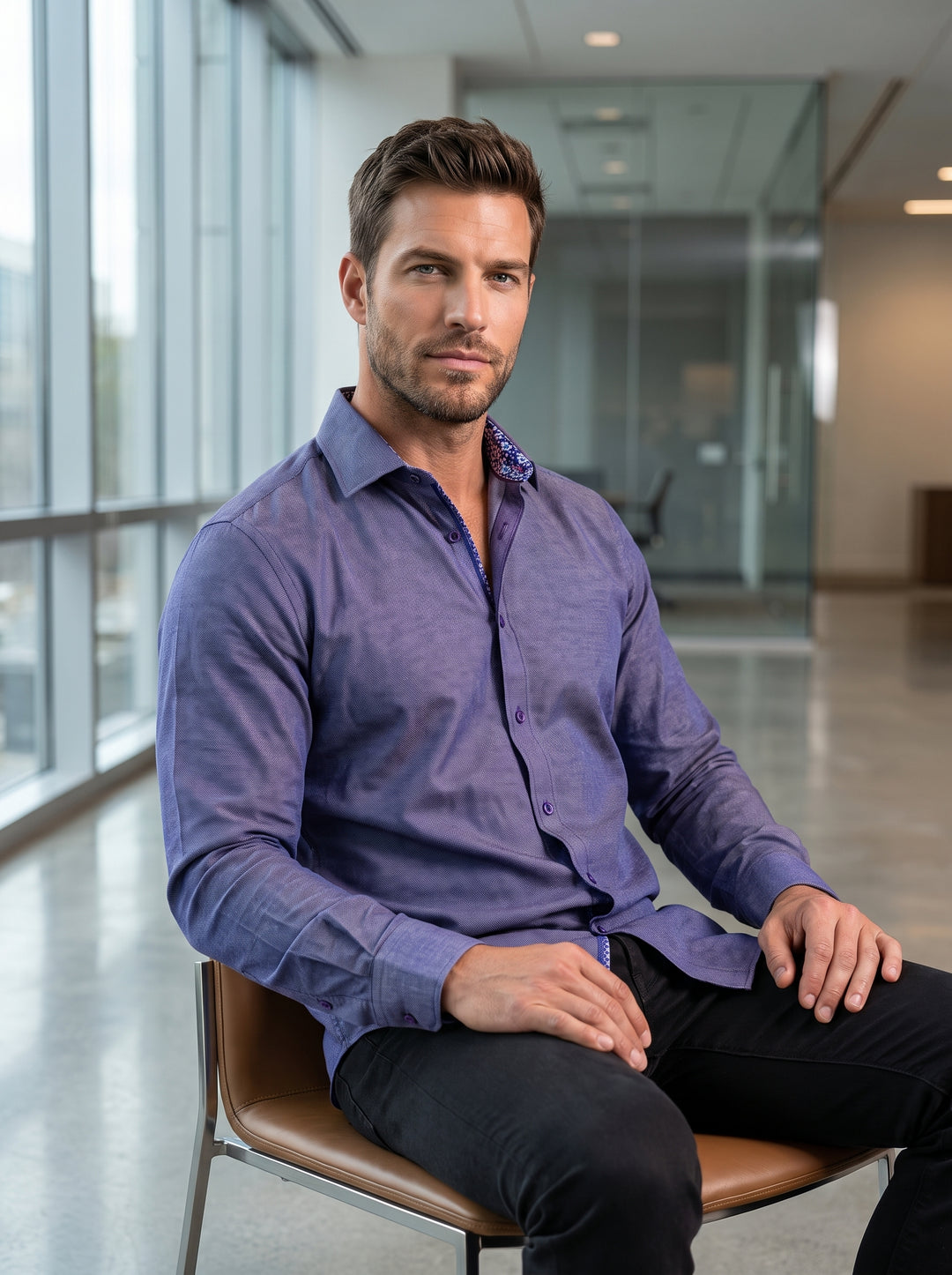 This sophisticated long-sleeve button-down shirt features a rich indigo purple heathered texture with contrasting floral trim inside the collar. Tailored for a modern fit, it provides a polished look suitable for transition from the office to evening soci