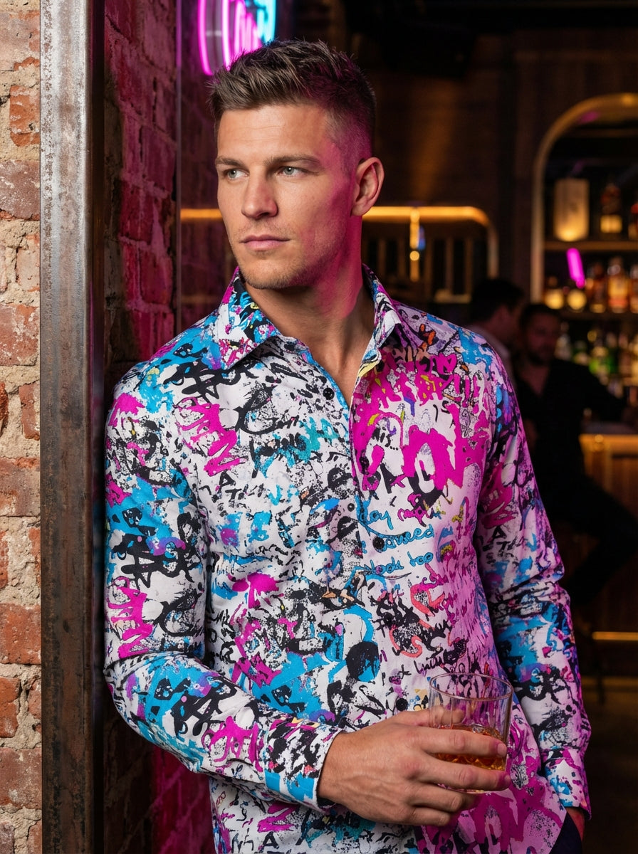 This Bertigo long-sleeved button-down shirt features a vibrant, all-over graffiti-inspired print. Splashes of neon pink, electric blue, and black script cover the white cotton fabric, creating a bold, street-art aesthetic with a crisp collar and dark cont