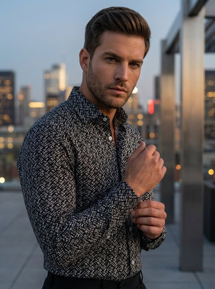 This Masutto men's dress shirt features a sophisticated monochrome geometric grid pattern. Crafted with a classic collar and pearlescent buttons, the intricate white-on-black crosshatch design offers a modern, textured aesthetic suitable for contemporary 