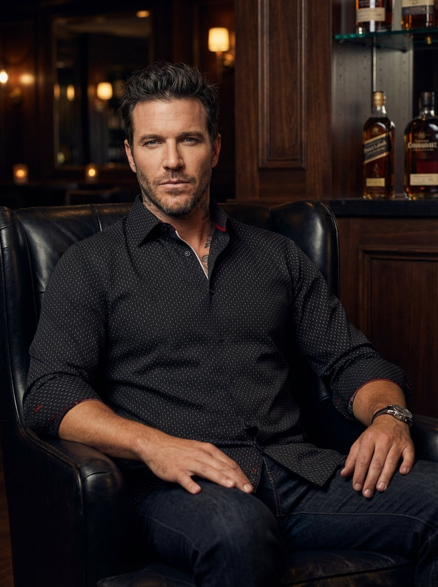 This sophisticated black long-sleeve button-down features a refined white micro-dot pattern and subtle red contrast stitching. Crafted for a tailored fit, it offers a sharp silhouette perfect for evening wear, blending classic masculine style with contemp