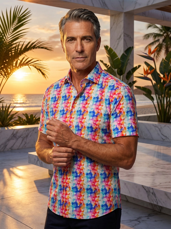 This Masutto short-sleeve button-down shirt features a vibrant, kaleidoscopic floral print. Bursting with shades of electric blue, fuchsia, and bright orange, the intricate geometric patterns create a high-energy aesthetic perfect for making a bold statem