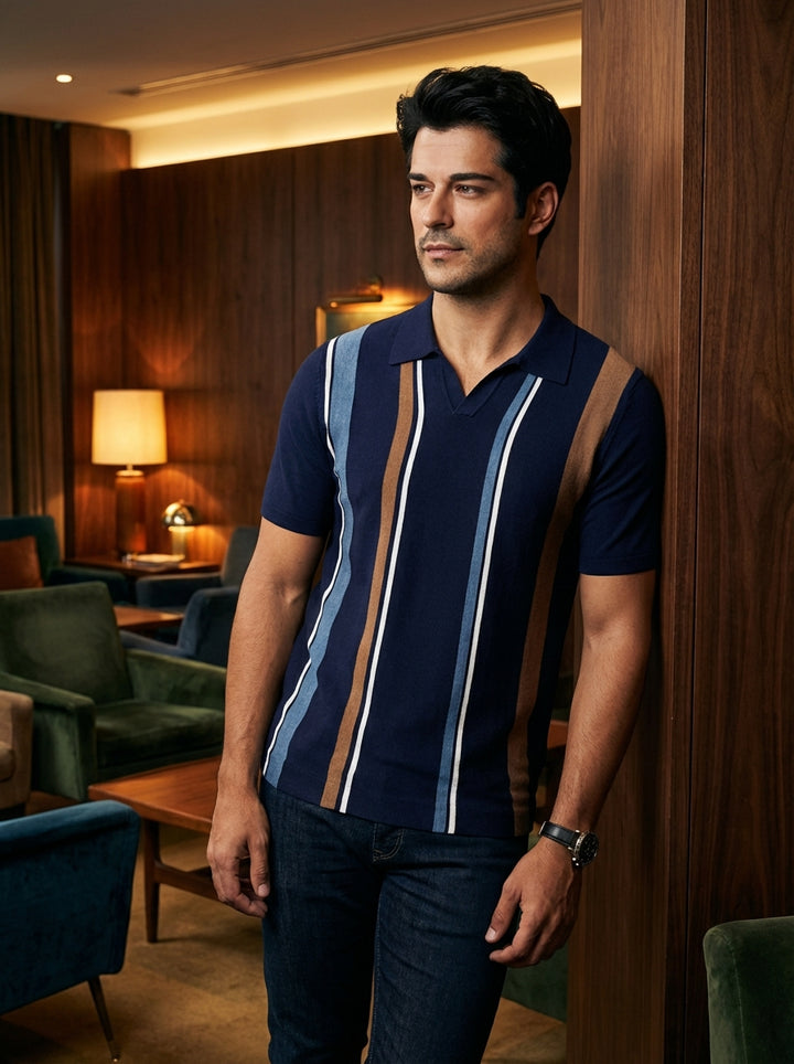 This navy short-sleeved knit polo features a refined vintage-inspired aesthetic. Characterized by bold vertical stripes in tan, light blue, and crisp white, the shirt offers a modern textured finish and a sharp open collar for effortless, sophisticated sm