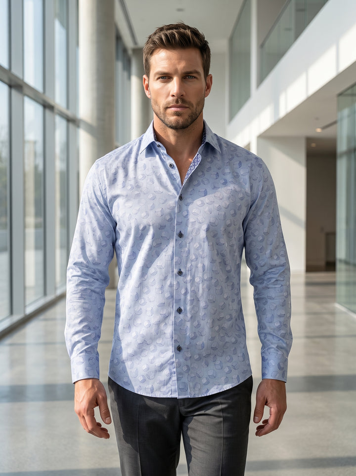 A sophisticated light blue long-sleeved button-down shirt featuring an intricate all-over geometric cube pattern. Crafted with a tailored fit, it includes a contrasting patterned inner collar and dark buttons for a refined, modern look suitable for upscal