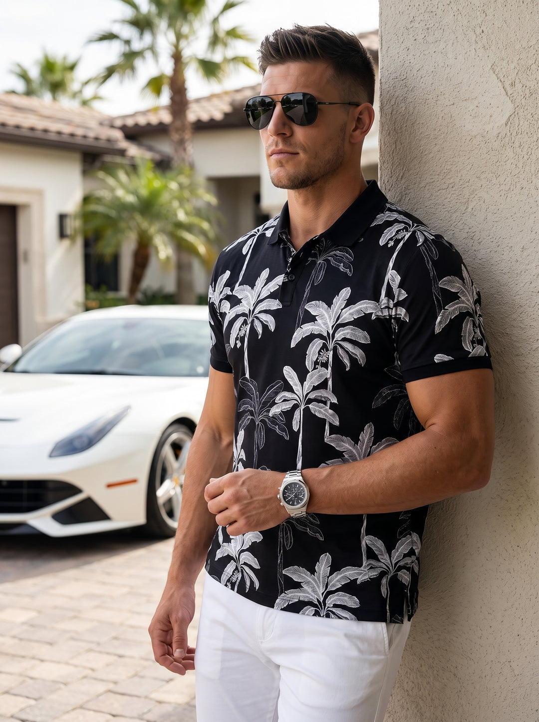 This stylish men's polo shirt features a bold monochromatic tropical aesthetic. Crafted in black with a contrasting white palm tree print, it offers a regular fit with a classic button-down collar and short sleeves, blending casual comfort with sophistica