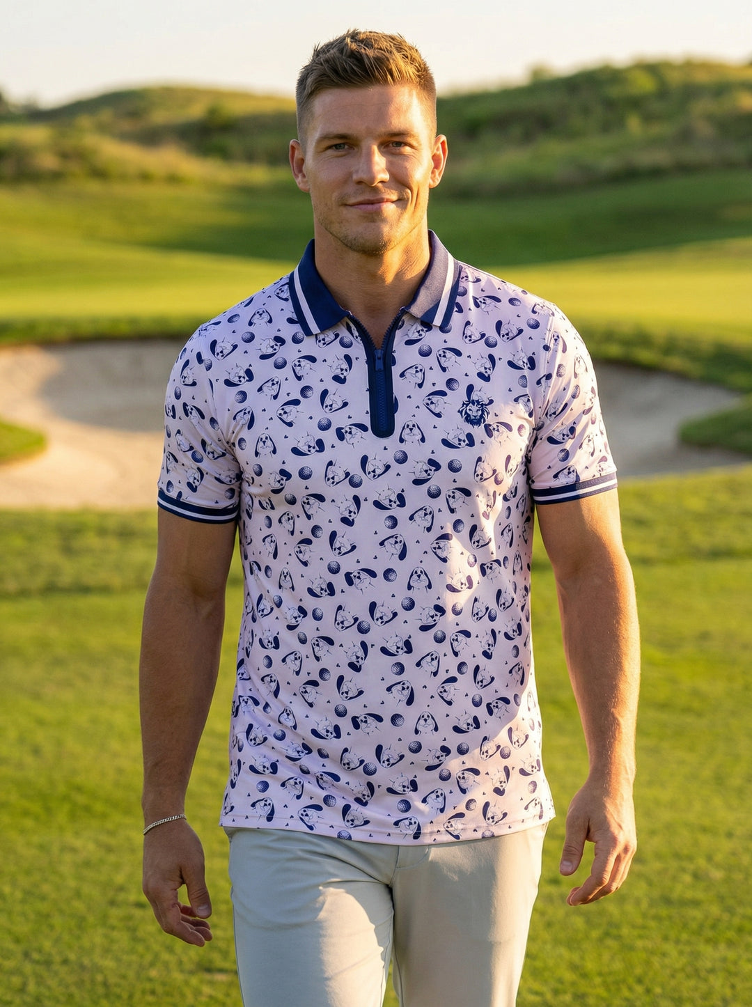 This short-sleeved polo shirt features a unique lavender and navy graphic print of stylized dogs and golf balls. It includes a zippered navy collar with white striped detailing, tipped cuffs, and a tailored fit perfect for active sporting sessions.