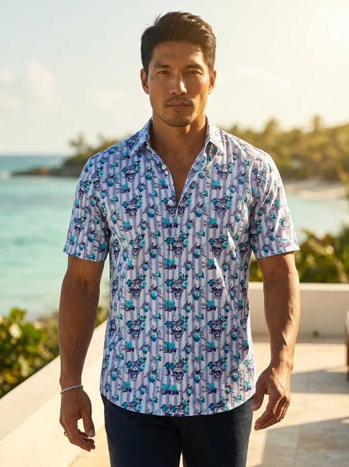 This short-sleeved button-down shirt features a unique combination of classic vertical stripes and an edgy skull-and-floral motif. The cool blue and turquoise palette adds a refreshed, modern twist to the rebellious design, perfect for bold, contemporary 