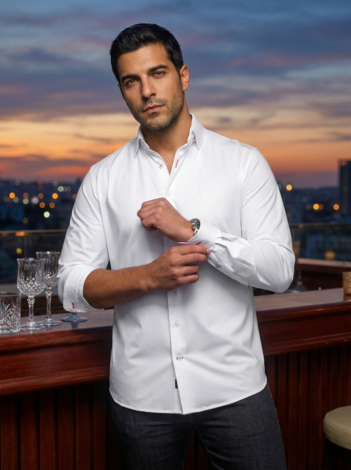 Elevate your wardrobe with this premium white long-sleeve dress shirt. Crafted from high-quality cotton for a crisp finish, it features subtle red contrast stitching on the buttonholes and a sharp point collar, offering a sophisticated look for modern gen