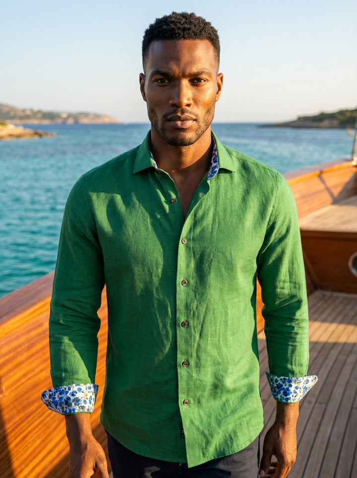 This emerald green button-down shirt from Masutto features a rich linen-like texture and a classic pointed collar. The interior collar stand and cuffs are lined with a blue floral pattern, accented by sophisticated dark hardware for a refined finish.