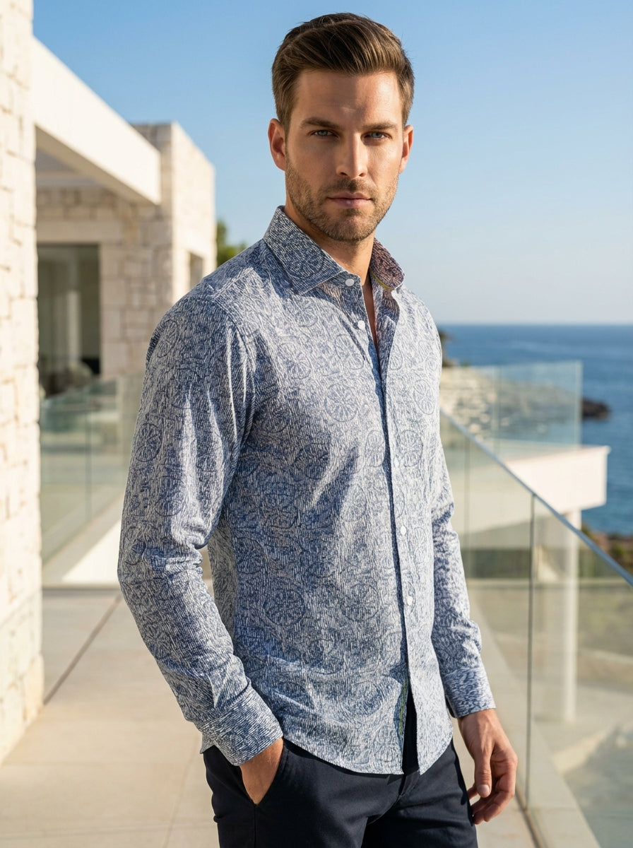 This Masutto long-sleeved shirt features a sophisticated blue and white geometric print, blending intricate linework with circular motifs. Crafted from premium fabric, it offers a sharp collar and polished button detailing, making it ideal for elevated ca