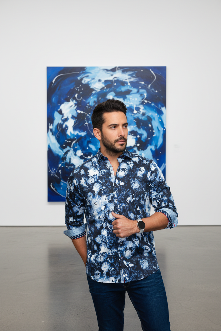 This men's sophisticated button-up shirt features an abstract floral print in deep blues and white, exuding modern elegance. Its tailored fit and distinctive pattern are perfect for upscale casual ensembles.