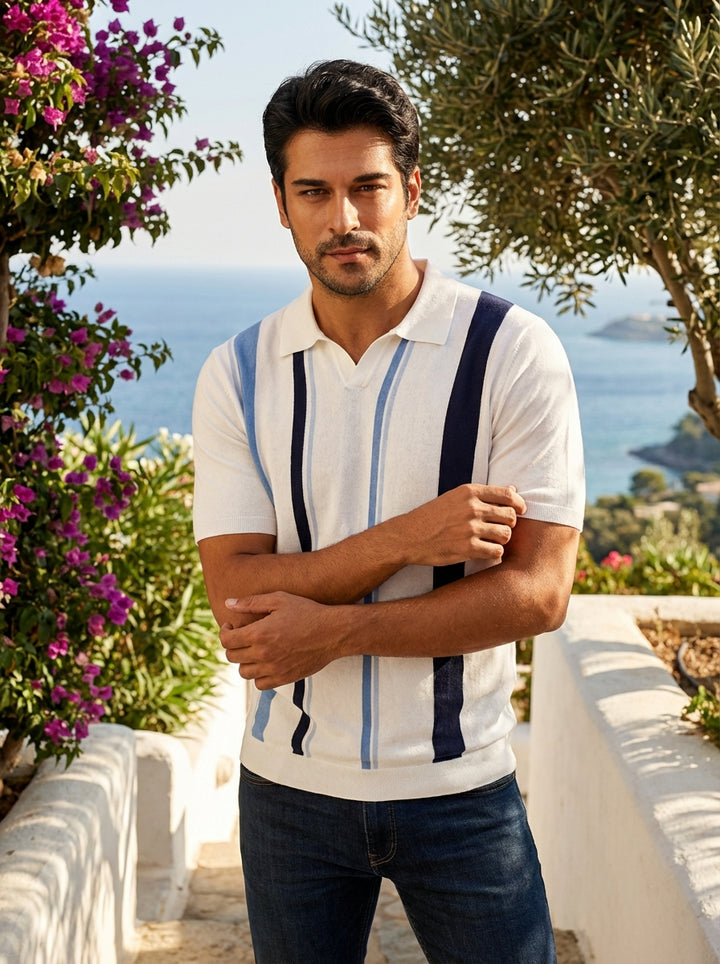 This sophisticated men's short-sleeve knit polo features a crisp white base accented by bold vertical stripes in navy and sky blue. Crafted with a classic open collar and a refined tailored fit, it offers a modern take on retro-inspired leisurewear.