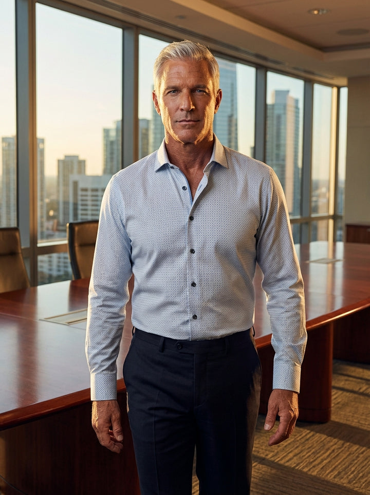 The Masutto men's dress shirt features a sophisticated micro-dot pattern in blue over a crisp light background. Crafted with a spread collar and dark contrasting buttons, this premium long-sleeve garment offers a modern, tailored fit suitable for professi