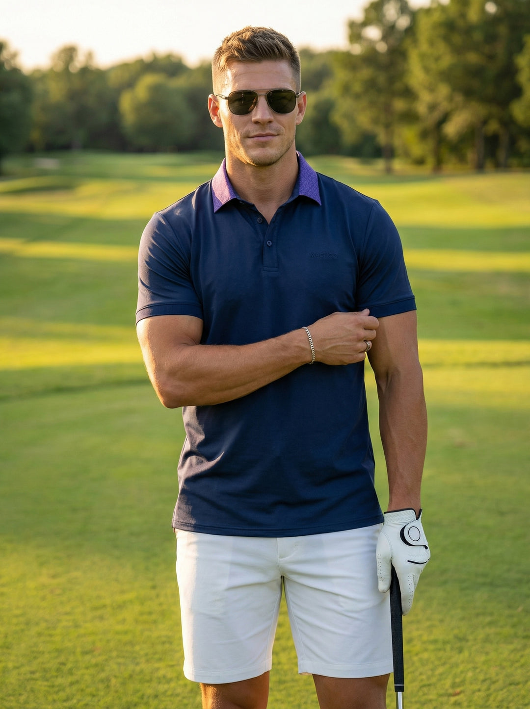 This sophisticated navy blue polo shirt features a unique contrasting purple patterned collar and a three-button placket. Crafted with a tailored fit, it includes a subtle embroidered logo on the chest, offering a modern twist on a classic athletic silhou