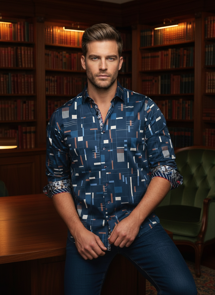A modern navy button-down featuring a striking geometric grid pattern. Accented with intricate floral-lined cuffs and a contrast collar, this tailored piece merges contemporary graphic design with classic sartorial detail for a refined, eclectic look.