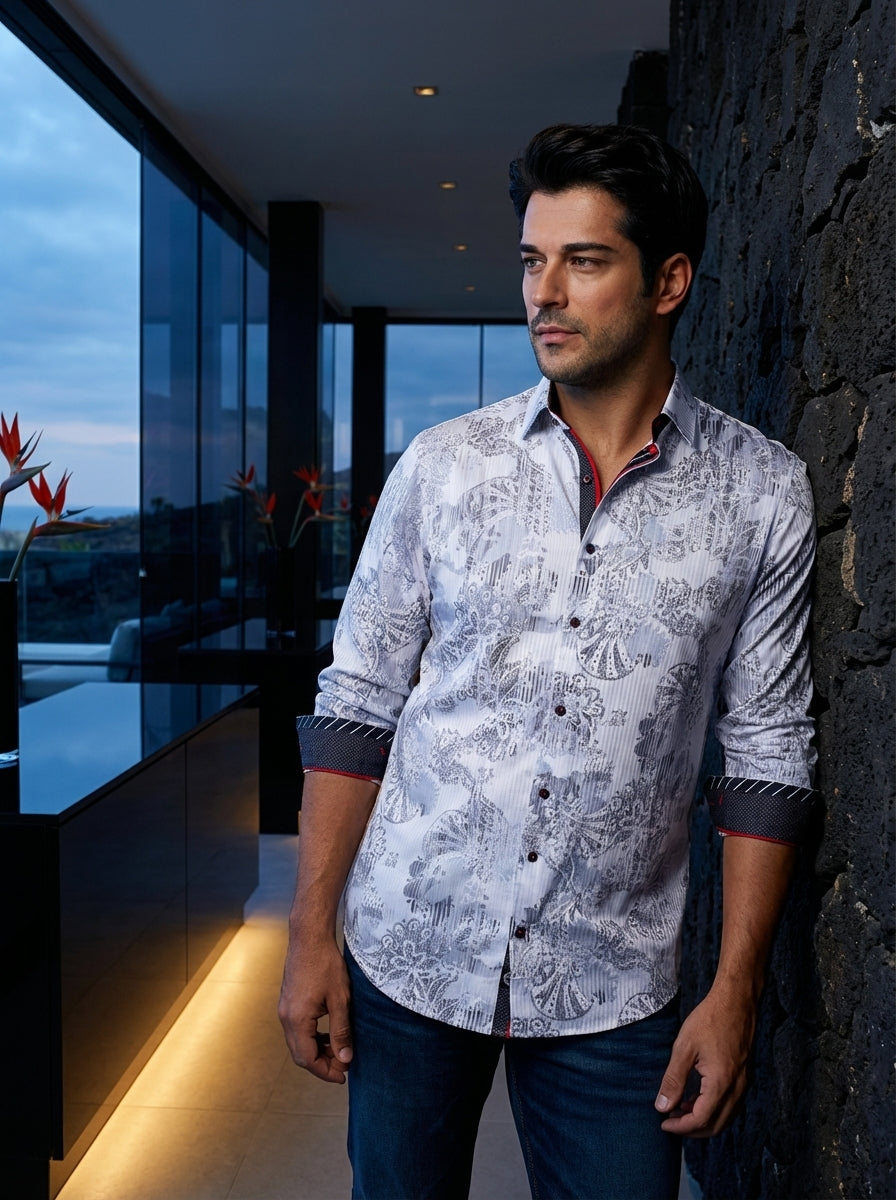 This premium white button-down shirt features an intricate grey paisley and floral motif set against subtle vertical stripes. Contrast detailing on the inner collar and cuffs, highlighted by vibrant red piping, adds a modern, sophisticated edge to this ta
