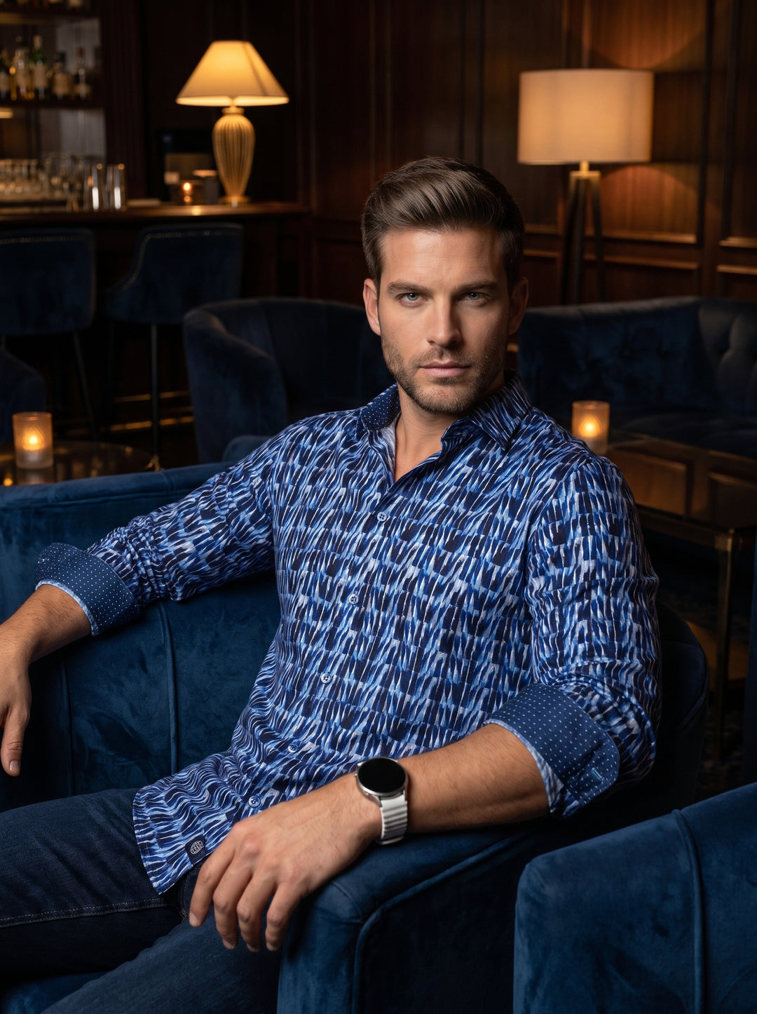 This premium long-sleeved button-down shirt features a striking blue and white abstract geometric pattern with a subtle gradient effect. Crafted from high-quality fabric, it includes contrasting micro-dot inner cuffs and a sophisticated spread collar, per