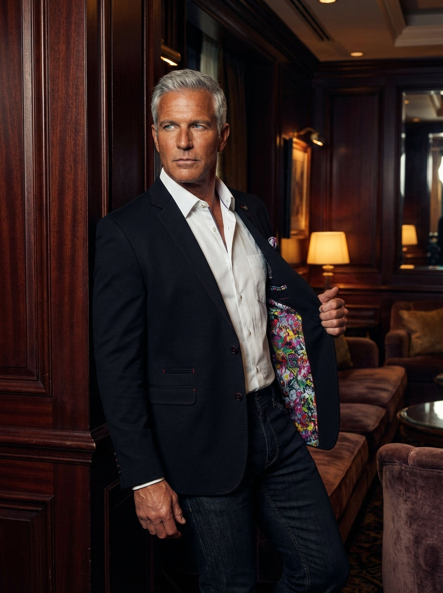 Elevate your evening attire with this sophisticated Au Noir black blazer. Featuring a tailored fit, unique contrast stitching, and a vibrant artistic interior lining, it seamlessly blends classic elegance with a bold, modern edge for the contemporary, sty