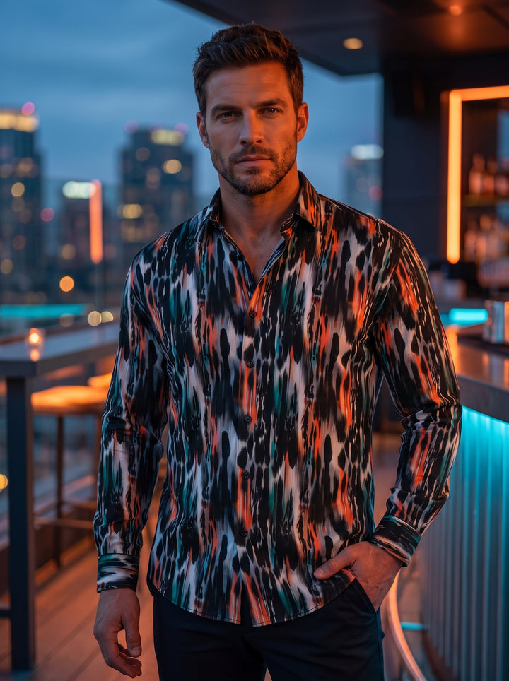 This mens long-sleeved button-up shirt features a striking abstract ikat-inspired print. Vertical strokes of black, grey, and vibrant orange with hints of teal create a dynamic, painterly effect. Crafted with a tailored fit, it offers a contemporary and a