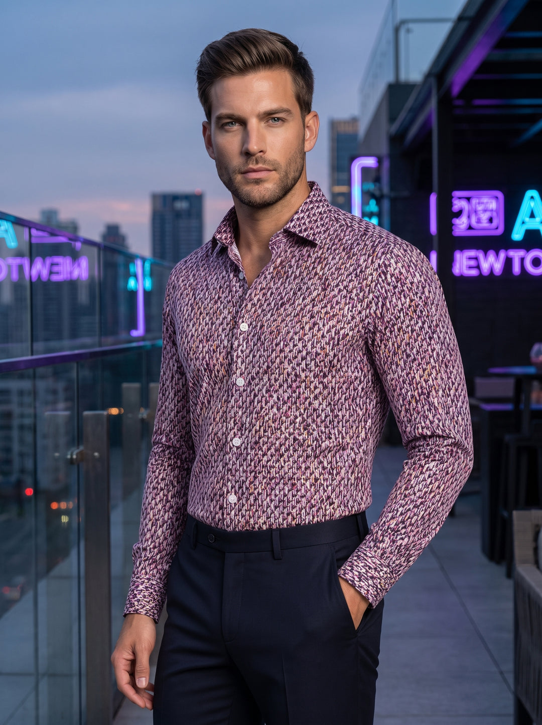 A long-sleeved tailored dress shirt featuring an intricate abstract print in shades of purple, mauve, and black. This slim-fit garment includes a pointed collar, white button fasteners, and mitered cuffs, paired with dark navy trousers for a polished look