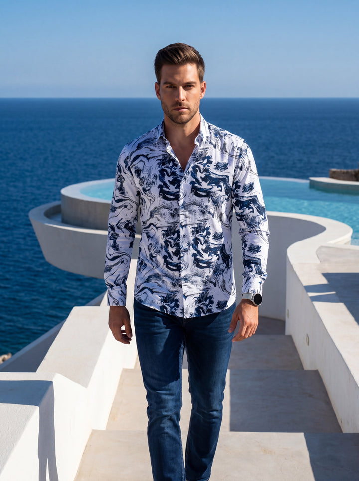 This men's long-sleeve button-down shirt features a striking white base with an abstract, marbled navy blue swirl pattern. Crafted for a tailored fit, it offers a modern, sophisticated aesthetic suitable for transition from upscale casual to semi-formal e