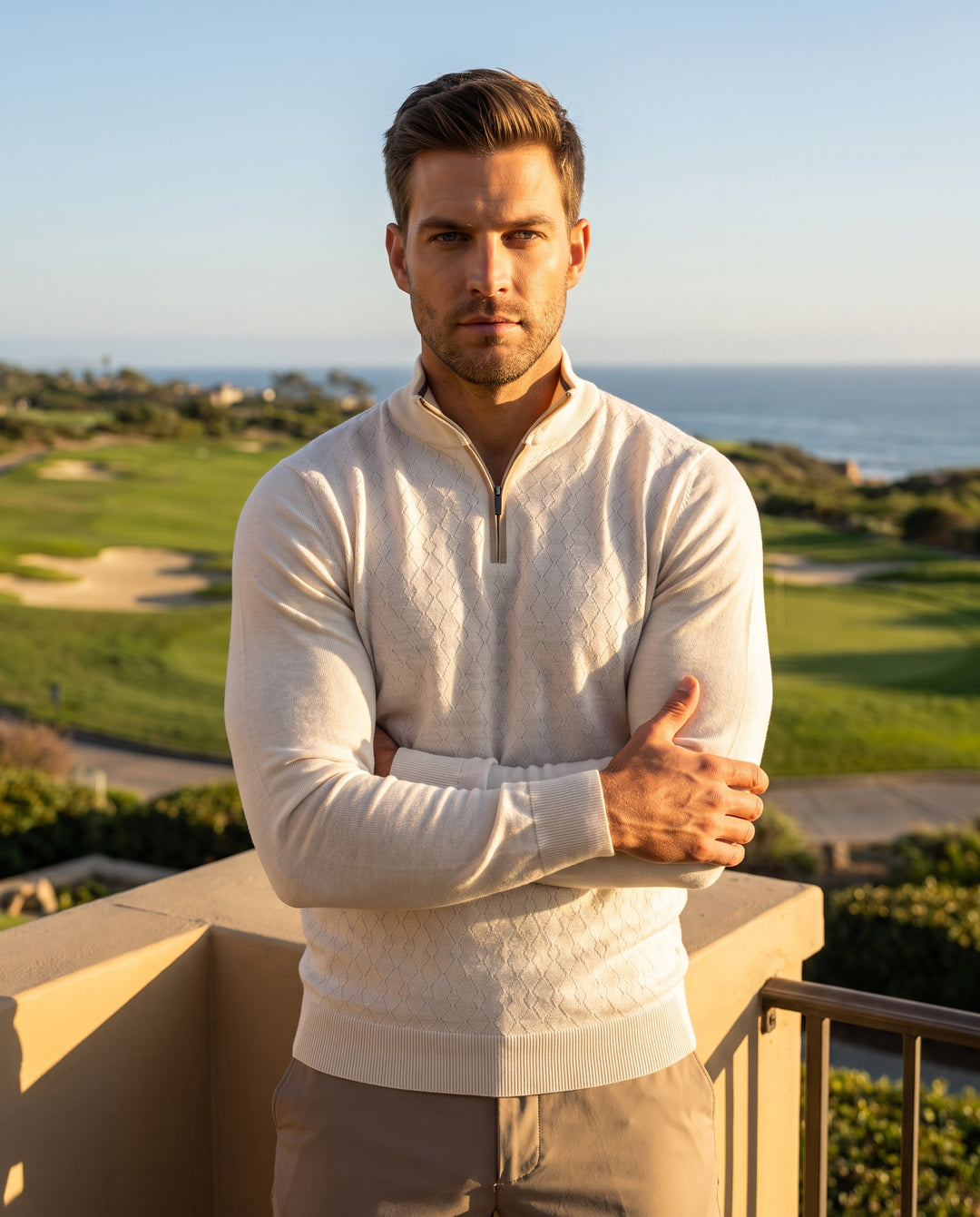 This sophisticated cream-colored quarter-zip sweater features an intricate diamond-knit texture across the front panel for a refined look. Crafted with long sleeves and ribbed cuffs, it offers a tailored fit that effortlessly combines comfort with a polis