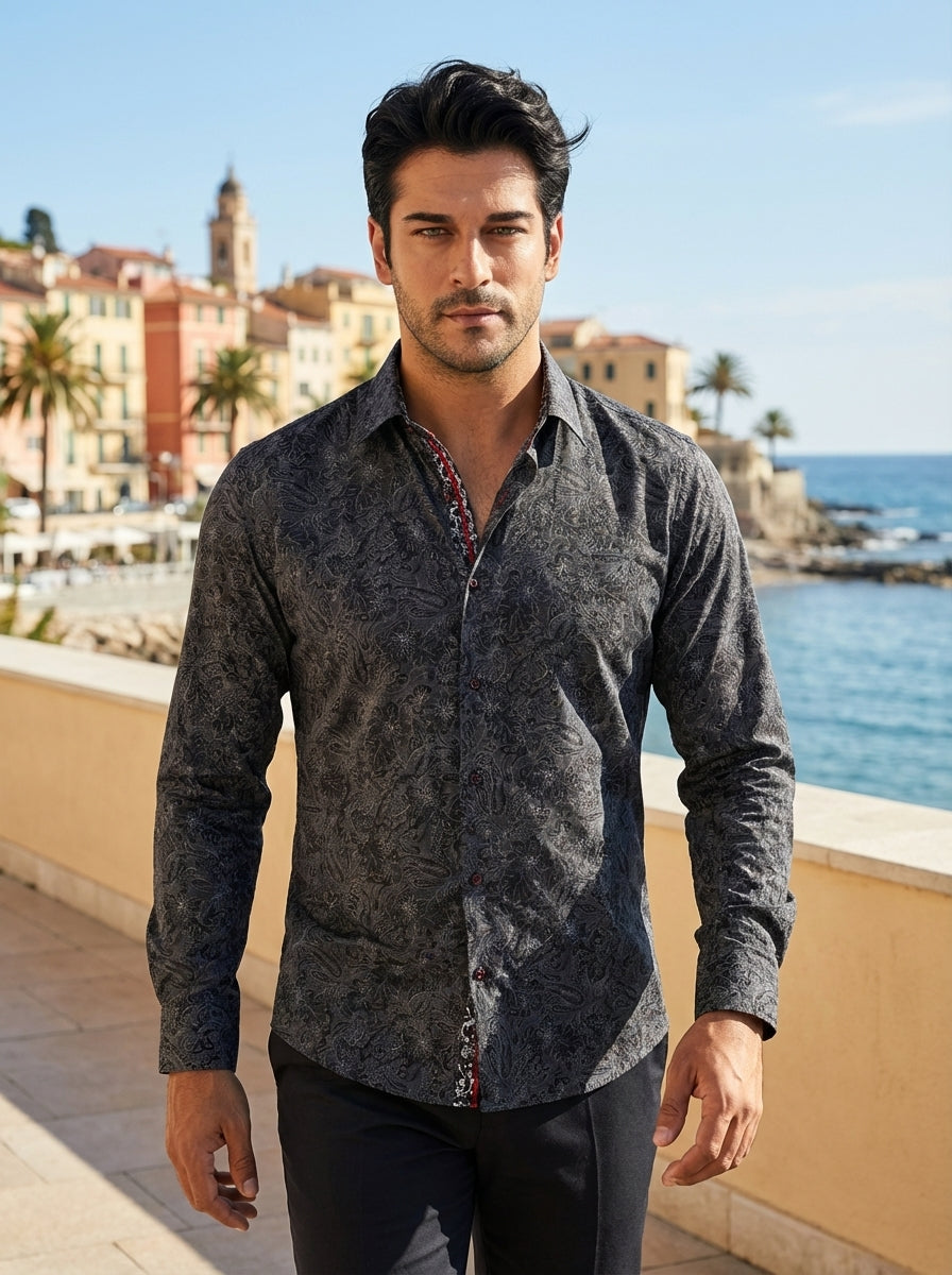 This sophisticated long-sleeve button-down shirt features an intricate charcoal and black paisley floral pattern. It is designed with a tailored fit, a structured collar, and contrasting red inner-placket detailing, making it an elegant choice for refined