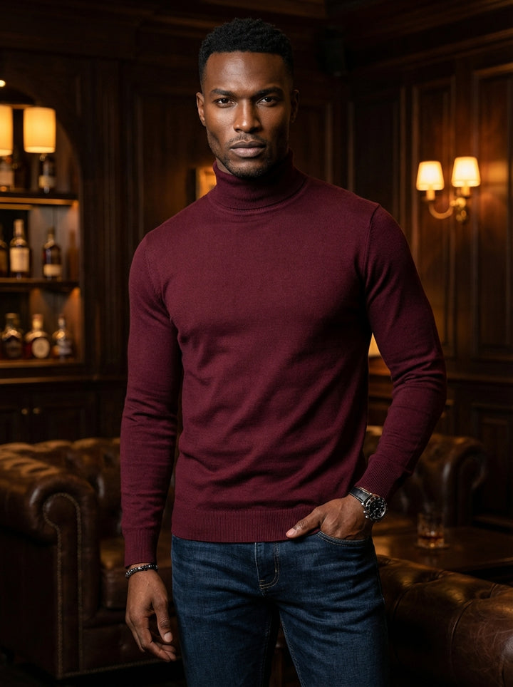 This sophisticated men's turtleneck sweater features a rich burgundy hue and a refined, slim-fit silhouette. Crafted from a smooth, fine-gauge knit, it offers a clean look with ribbed cuffs and hem, perfect for layering or wearing as a standalone piece.