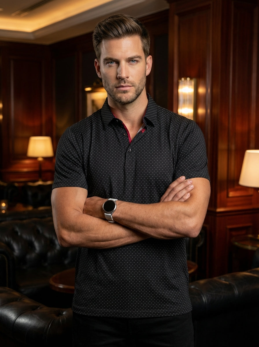 This sophisticated black short-sleeve polo features a delicate white micro-dot pattern, adding texture and depth. Crafted with a classic collar and subtle red interior detailing, it offers a refined slim fit that seamlessly transitions from professional s