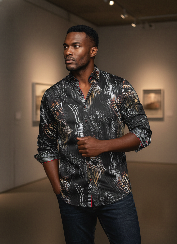 This sophisticated men's long-sleeve shirt features a striking abstract geometric and tribal pattern in a rich palette of black, white, gold, and brown, accented with subtle red detailing for a modern, luxurious appeal.
