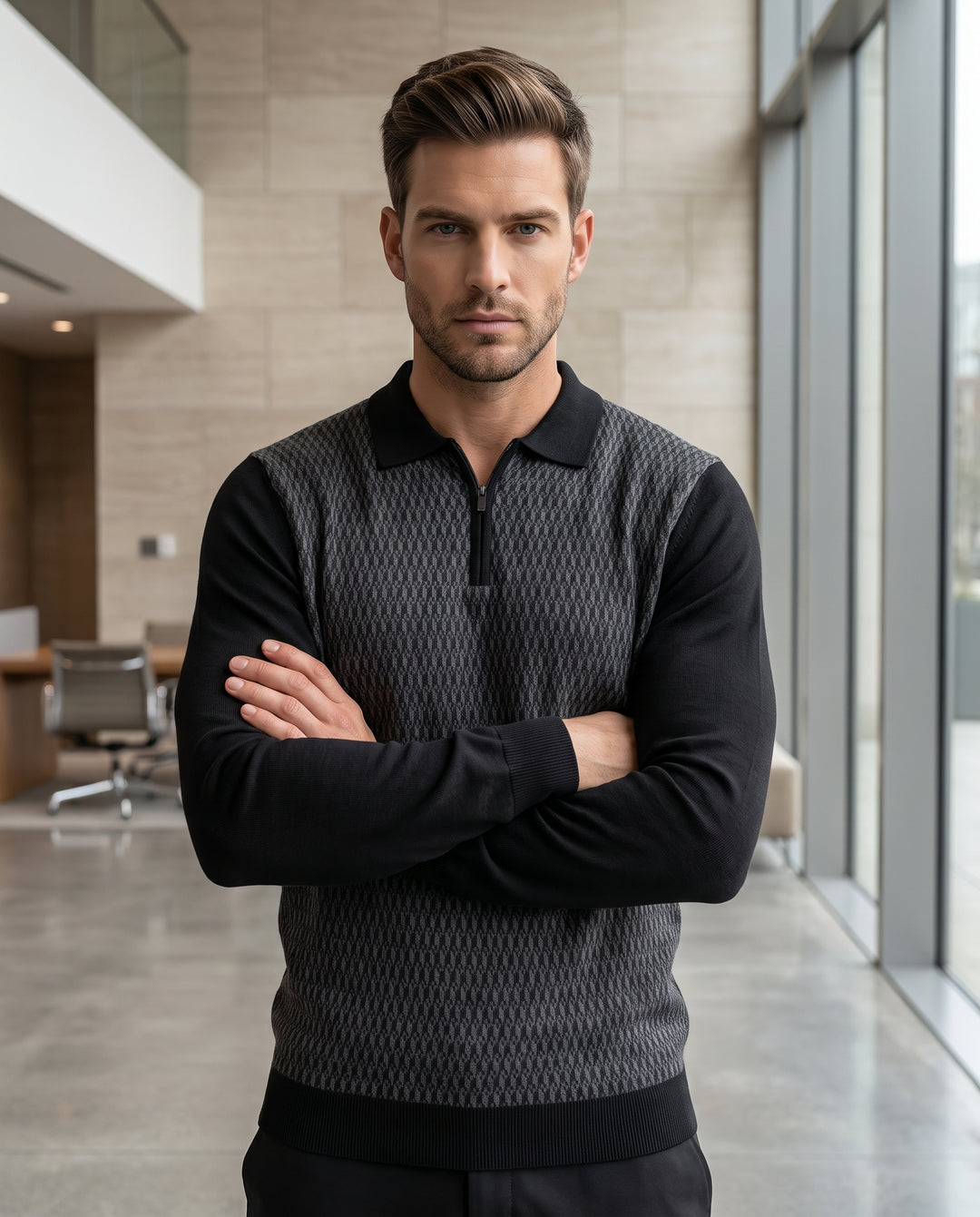 A sophisticated long-sleeve knit polo featuring a grey geometric-patterned front panel and solid black sleeves. The design includes a ribbed black collar, a functional quarter-zip neckline, and ribbed cuffs and hem for a tailored fit.