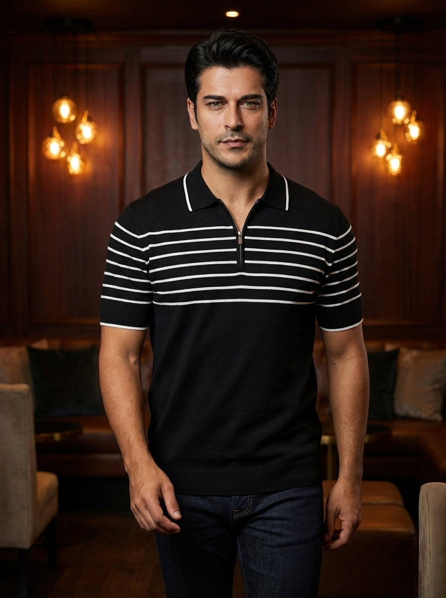 This sophisticated men's short-sleeved polo features a sleek black knit base accented by crisp white horizontal stripes across the chest and sleeves. A unique silver quarter-zip closure and contrast tipping on the collar add a modern, refined edge to this
