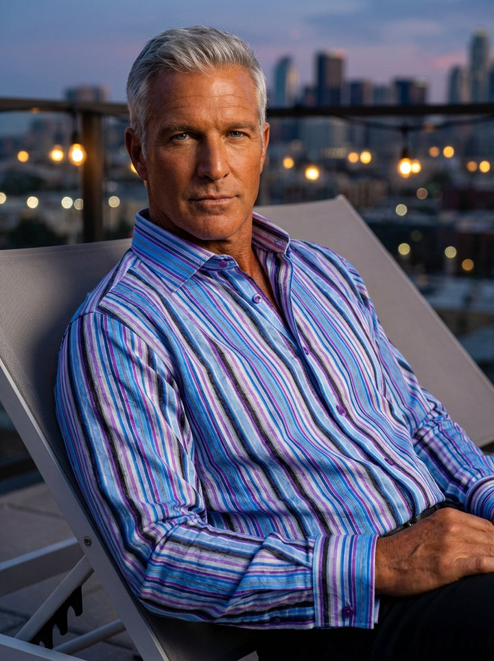 This Masutto long-sleeved dress shirt features a vibrant vertical stripe pattern in shades of blue, purple, and black. Detailed with textured floral jacquard overlays, it includes purple buttons and a structured collar for a sophisticated yet bold aesthet