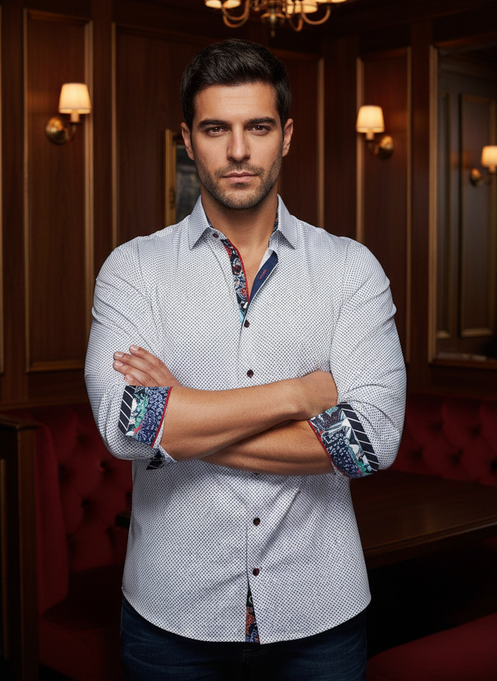 An exquisite white dress shirt featuring an intricate geometric micro-pattern. Vibrant, artistic floral-accented cuffs and inner collar add a bold, modern twist to this classic silhouette, perfect for making a sophisticated yet spirited statement.