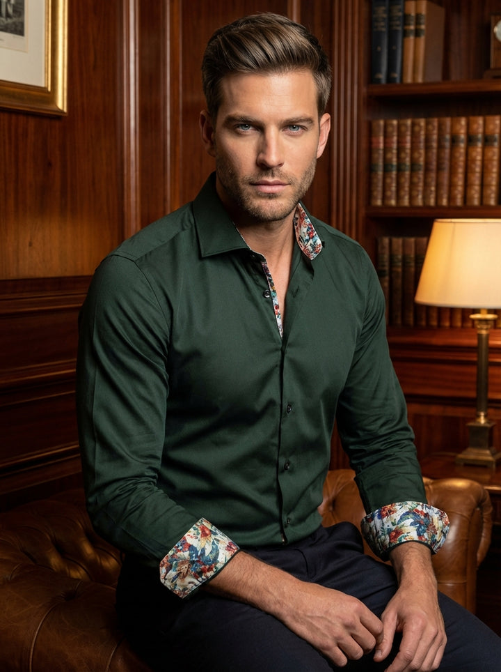 This premium Masutto men's dress shirt features a deep forest green hue, tailored for a sharp, modern fit. The design is elevated by a vibrant floral print lining on the inner collar and cuffs, offering a sophisticated, contemporary twist.
